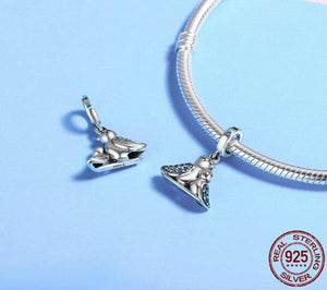Front and back of bird charm in sterling silver jewelry