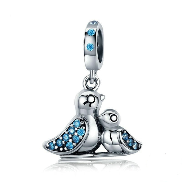 Silver bird charm with blue cubic zirconia